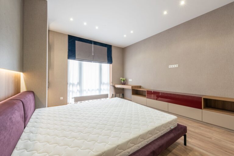 Clean bedroom with a white mattress